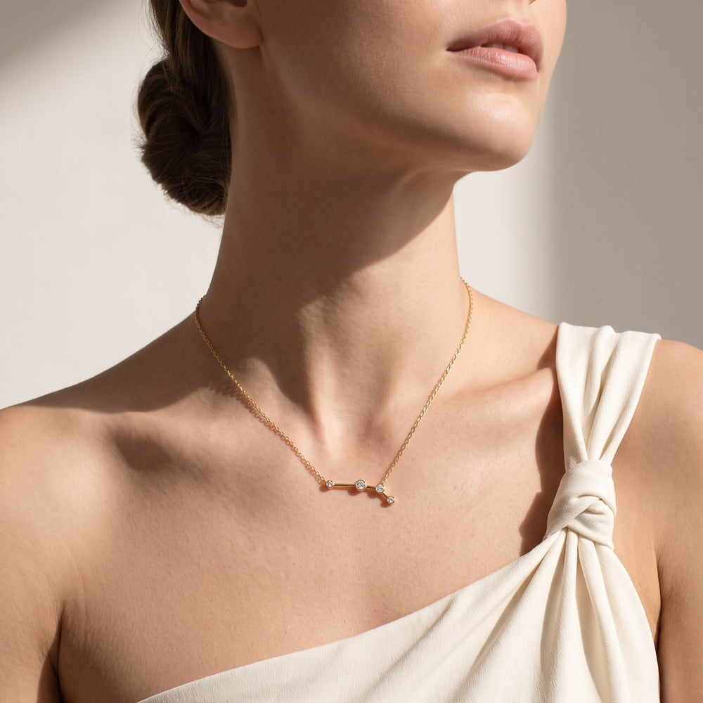 Aries constellation necklace worn at the neckline