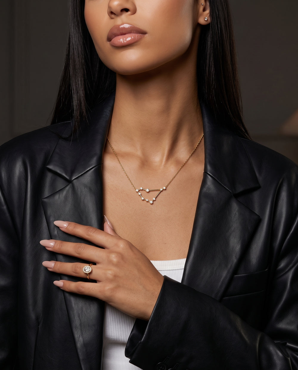 Capricorn constellation necklace worn at the neckline