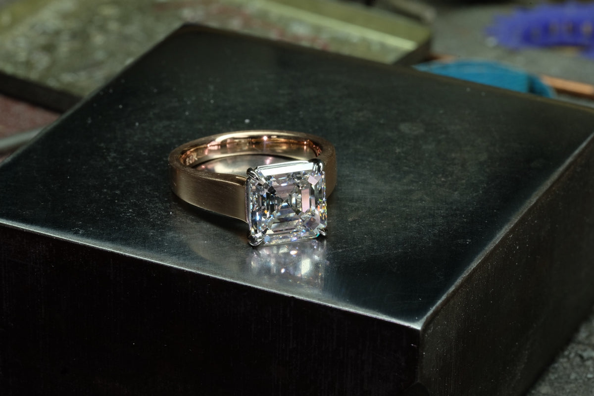 Asscher-cut diamond solitaire in platinum with brushed rose gold band