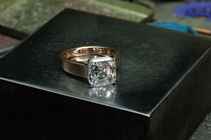 Asscher-cut diamond solitaire in platinum with brushed rose gold band