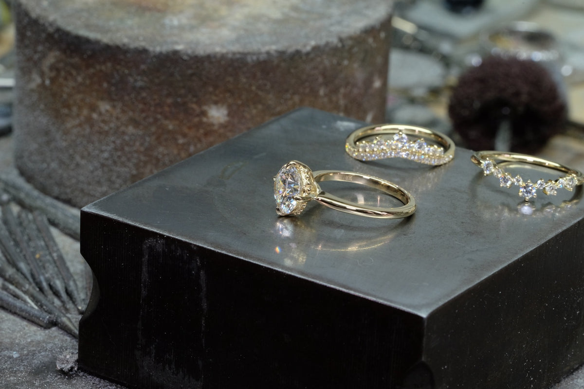 Diamond solitaire and two nesting bands in 18k yellow gold