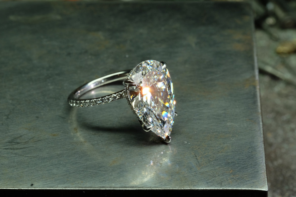Offset Pear Diamond Solitaire Ring, angled front view