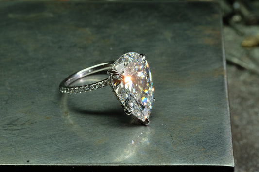 Offset Pear Diamond Solitaire Ring, angled front view