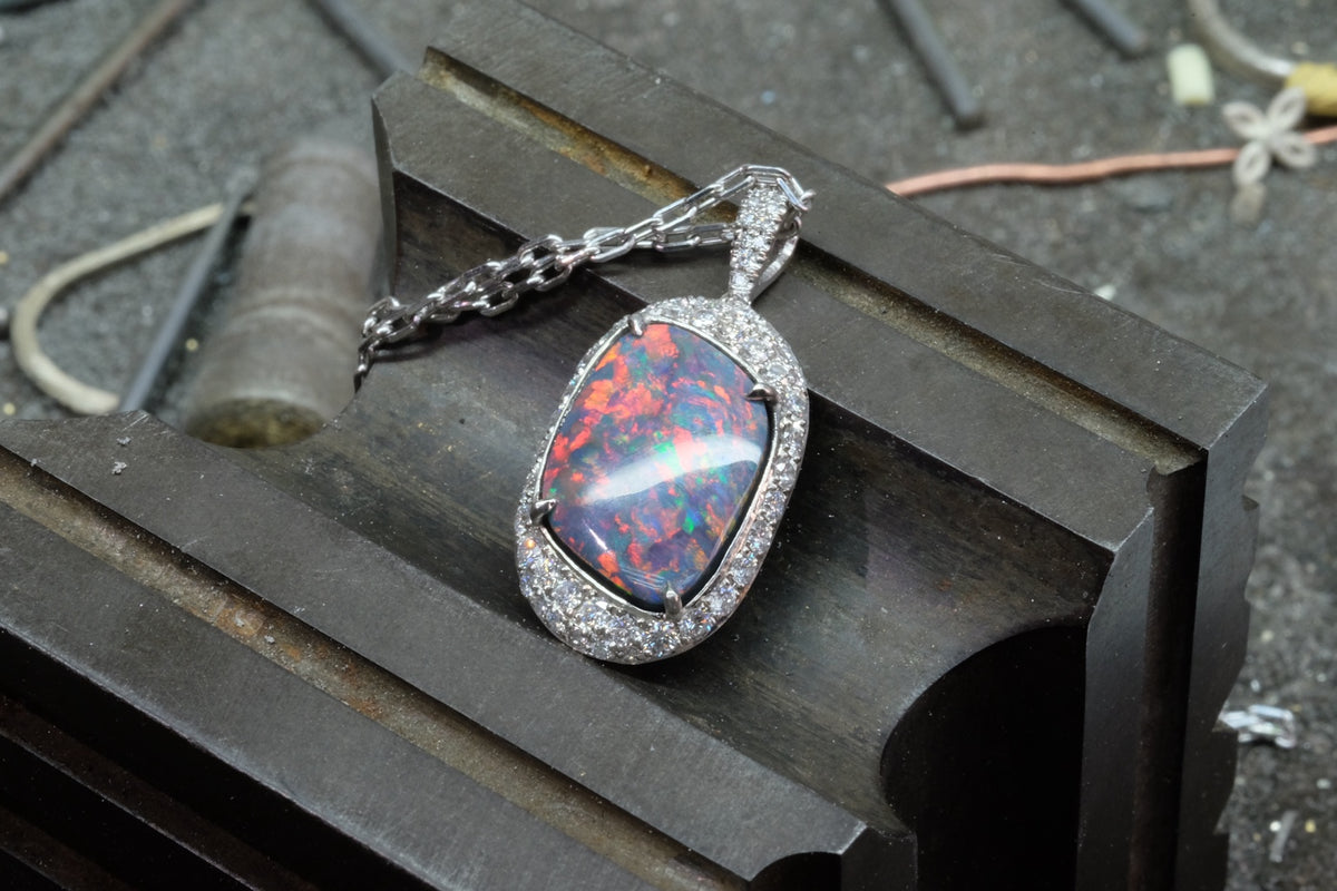 Opal & Diamond Halo Pendant, angled front view