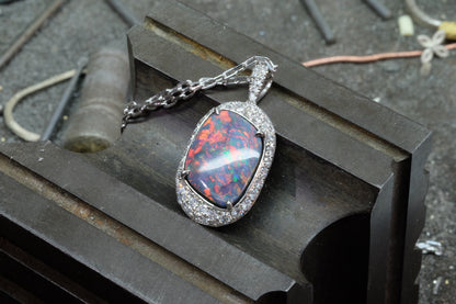 Opal & Diamond Halo Pendant, angled front view