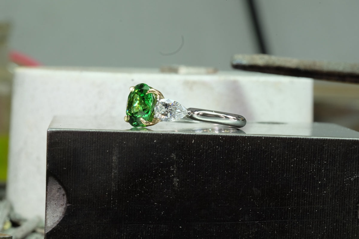 Oval Emerald & Pear Diamond Three-Stone Ring, side view
