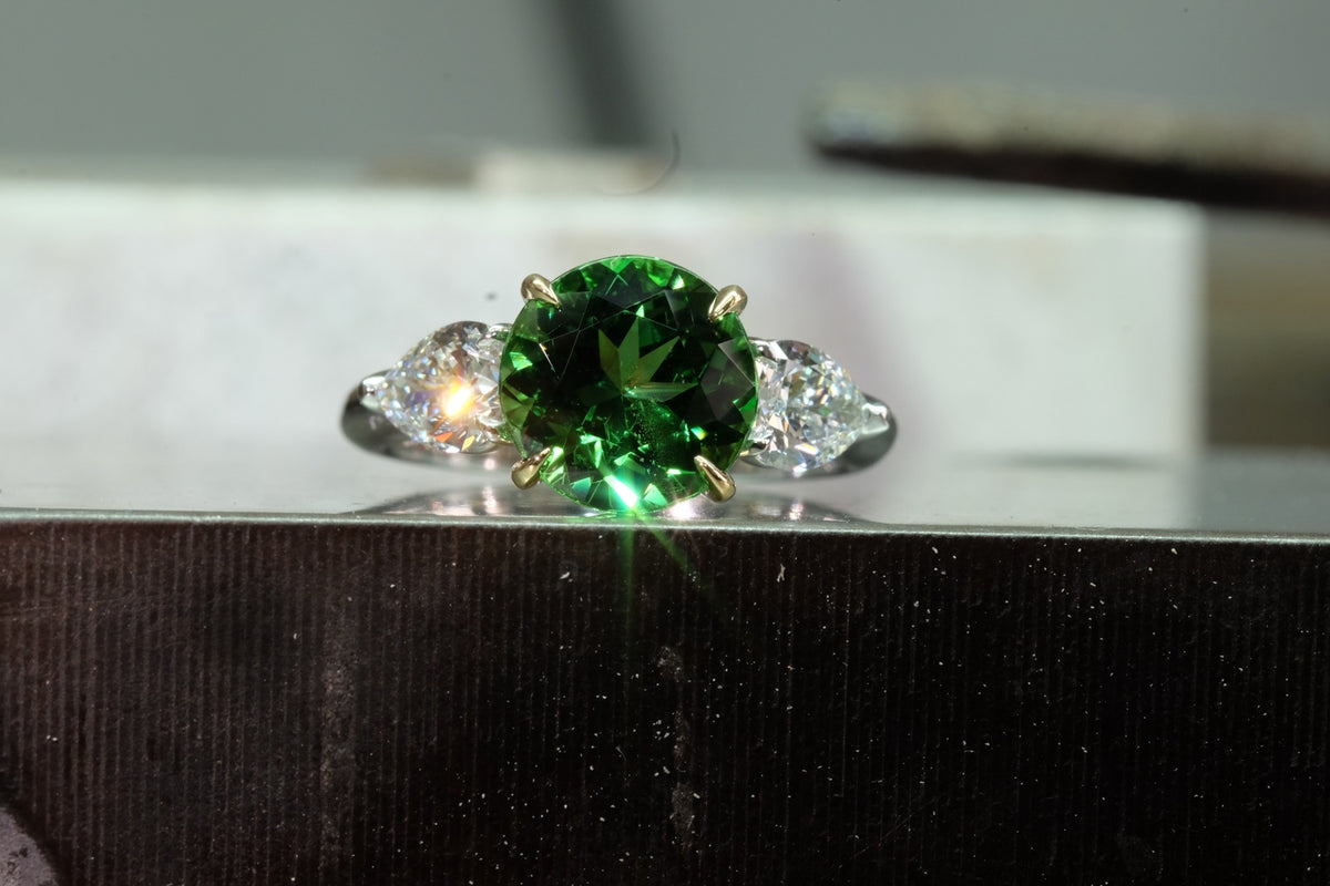 Oval Emerald & Pear Diamond Three-Stone Ring, front view