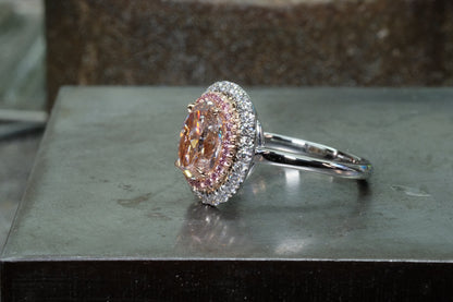 Pink diamond double halo ring in platinum, angled view