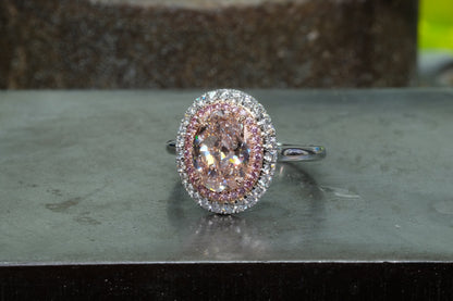 Pink diamond ring in platinum with pink and white round brilliant double halo, front view