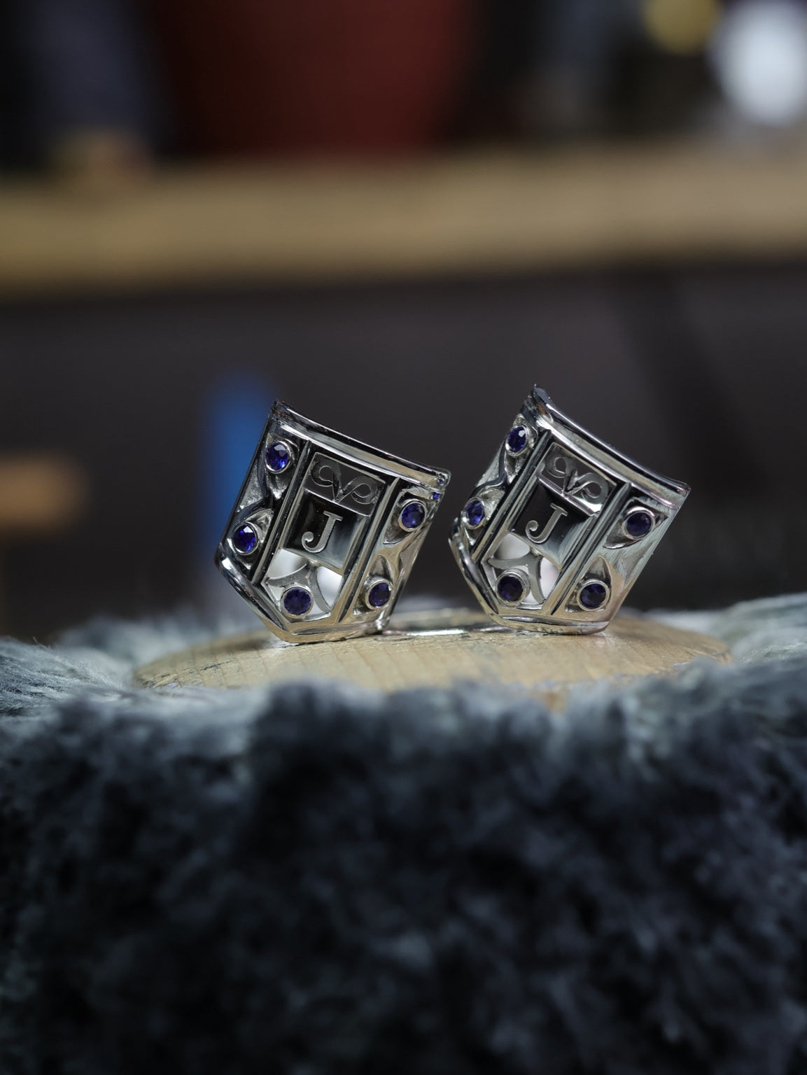 Finished platinum and sapphire cufflinks with engraved J monograms